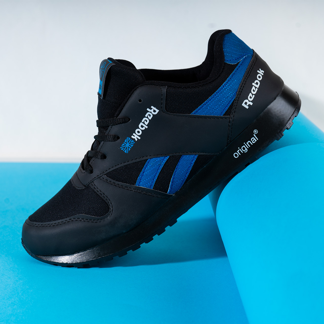 کفش ورزشی Reebok مشکی آبی مردانه مدلRako