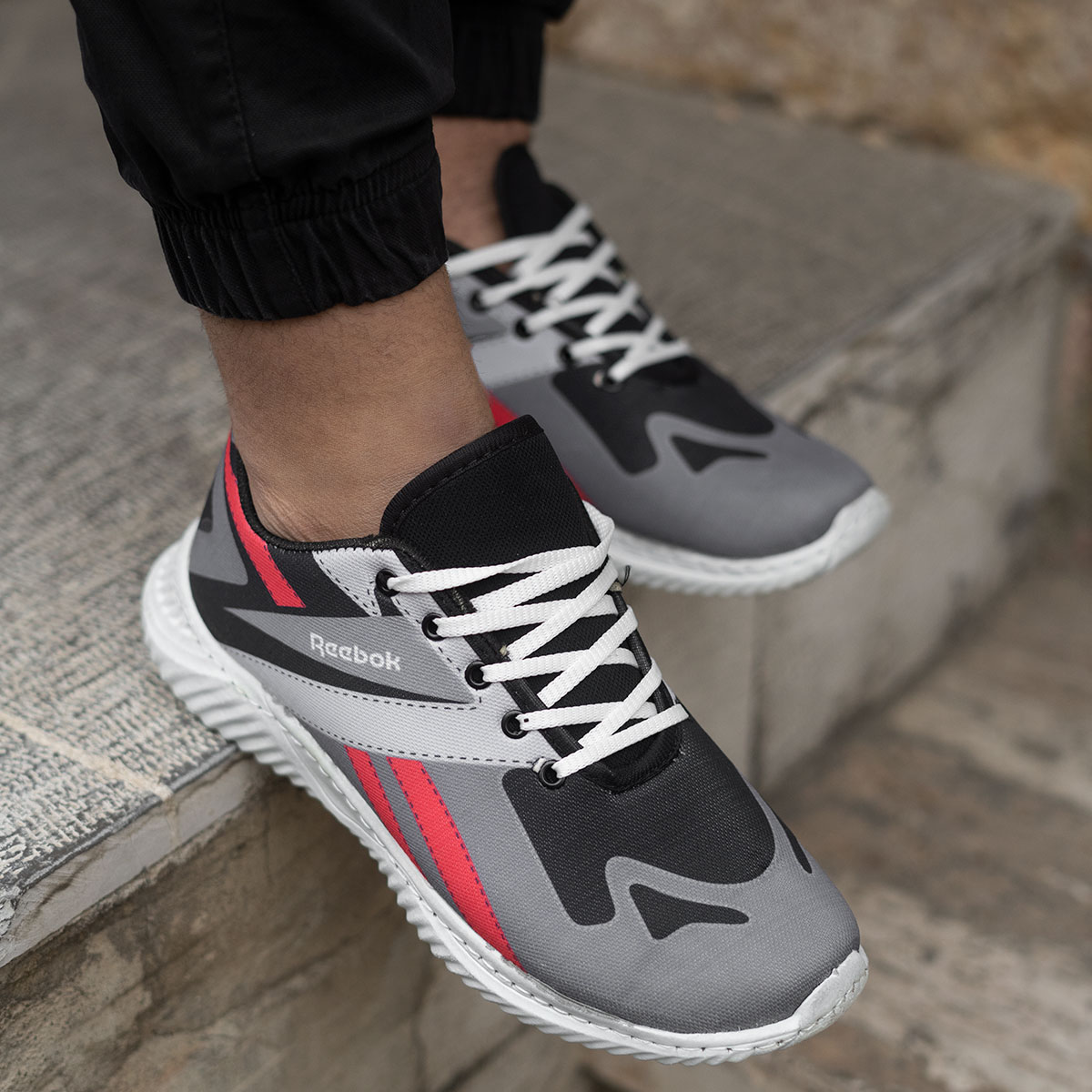 کفش ورزشی (T) ریبوک طوسی مردانه مدل adena